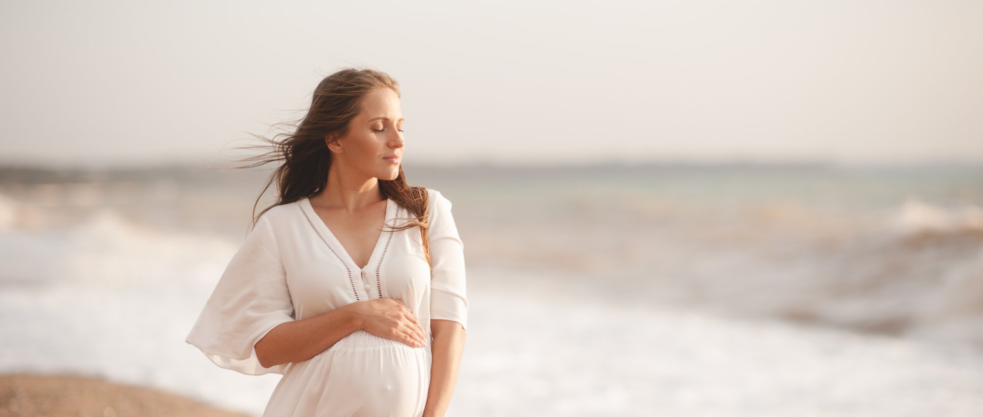 Pregnant woman on a beach
